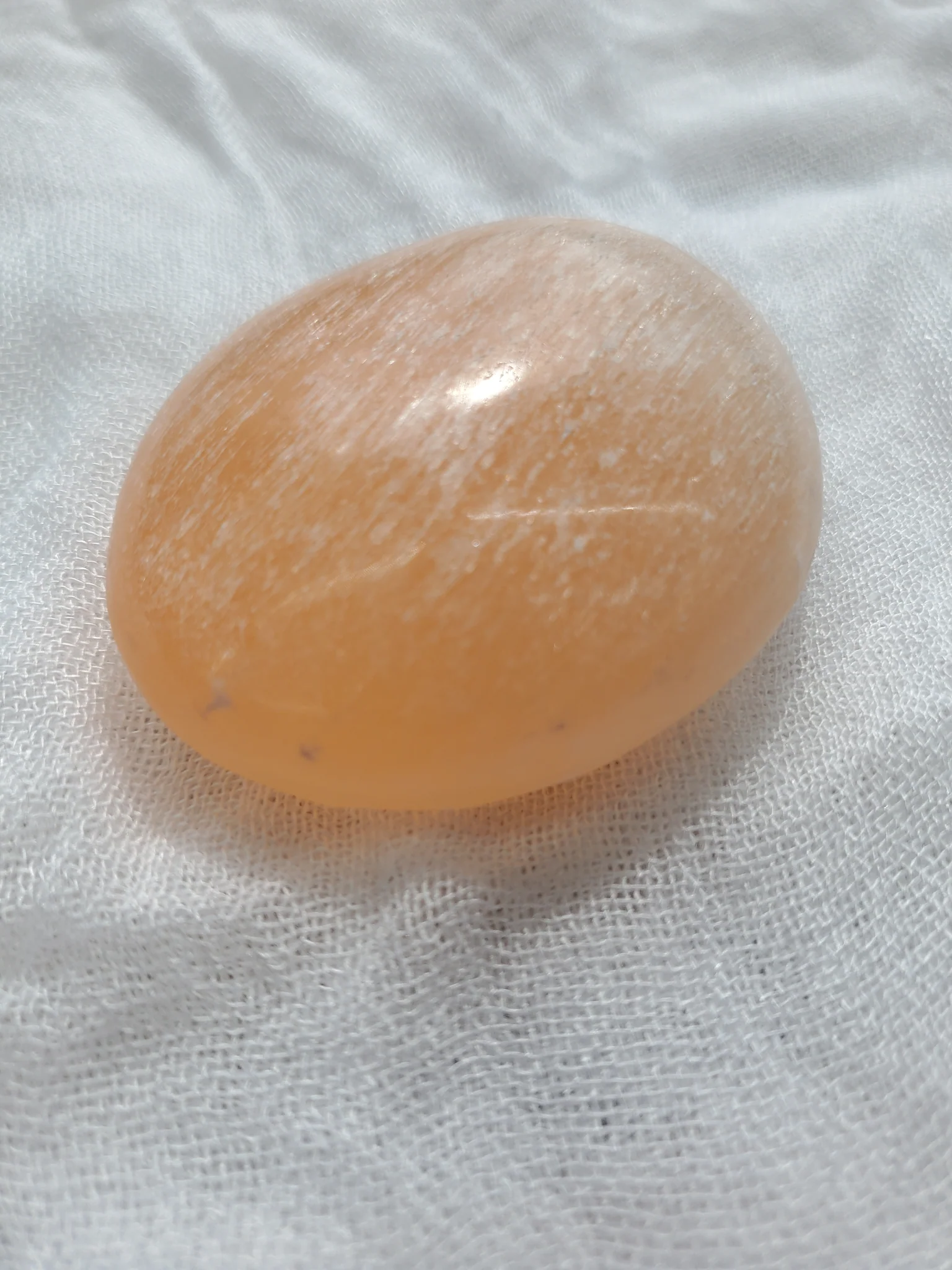 Peach Selenite Palm Stone - Image 2